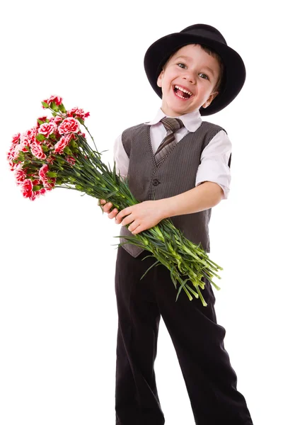 Счастливый мальчик с букетом гвоздик — стоковое фото