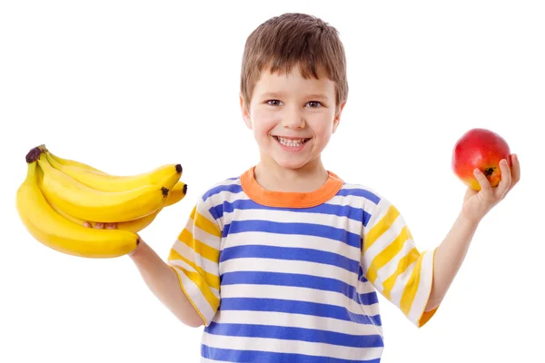 Счастливый мальчик держит бананы и яблоко — стоковое фото