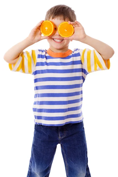 Funny boy with fruits on eyes — Stockfoto