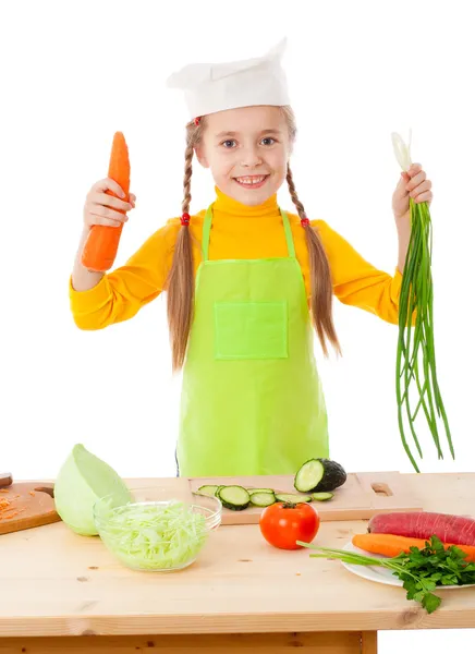 Pequeno fogão com legumes nas mãos — Fotografia de Stock