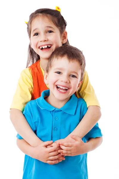 Two laughing little children standing together — Stock Photo, Image