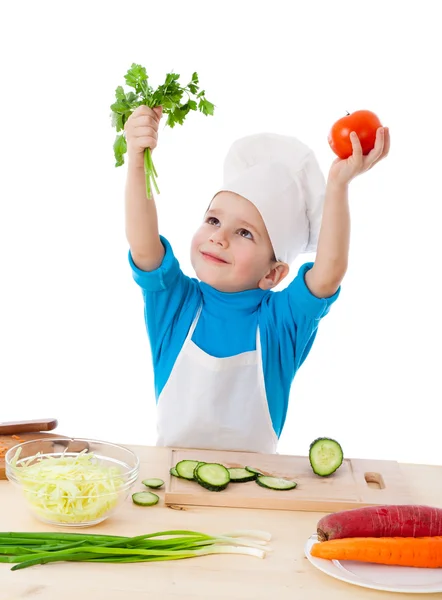 Little cook with parsley and tomatoes — Stock Photo, Image