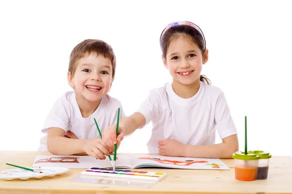 stock image Two smiling kids draw with watercolor