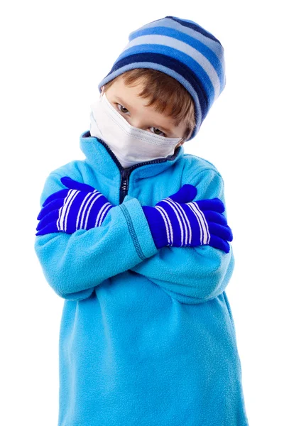Niño en ropa de invierno y máscara médica —  Fotos de Stock