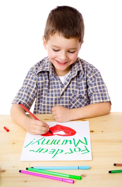 Маленький хлопчик малює для мами — стокове фото