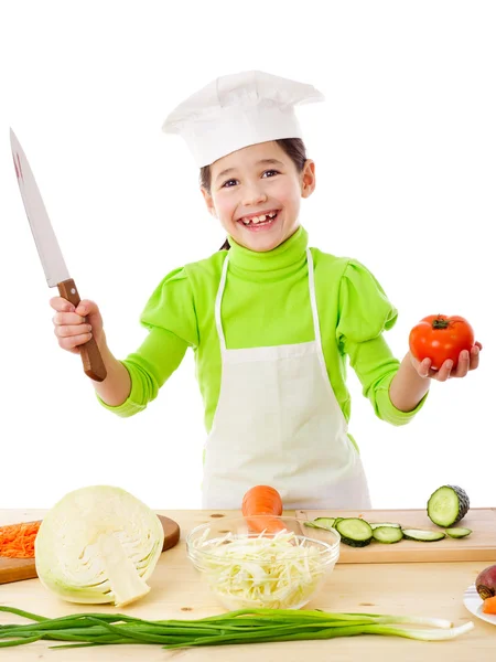 Pequeno cozinheiro com faca e tomate — Fotografia de Stock