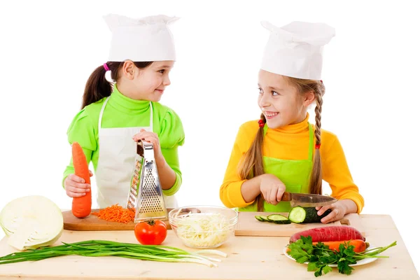 Two girls making salad — Stock Photo, Image