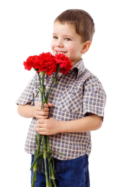 Smiling boy hiding a bouquet — Stock Photo, Image