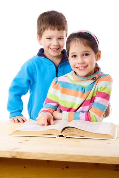 Two kids reading the book together — Stock Photo, Image