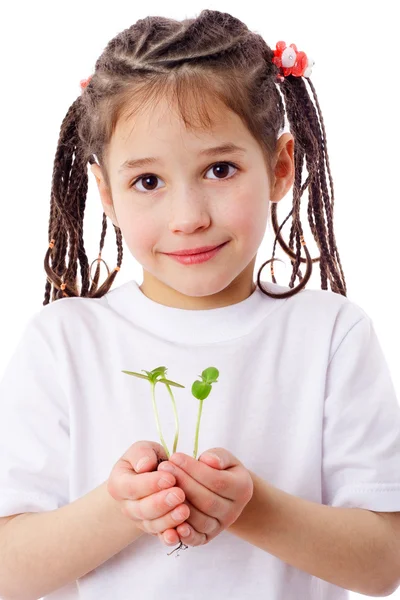 Girl with sprouts in hands — Stock Photo, Image