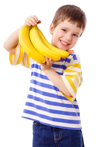 Ευτυχισμένο αγόρι κατέχει μια δέσμη μπανανών — Φωτογραφία Αρχείου