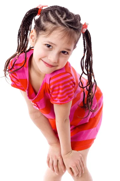 Pretty girl standing with hands on knees — Stock Photo, Image