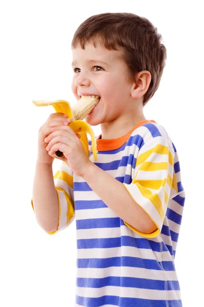Chlapec jí banán — Stock fotografie