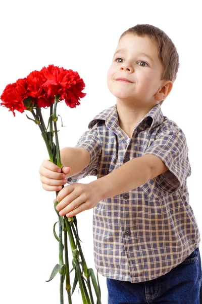 Smiling boy stretches forward a bouquet — Zdjęcie stockowe