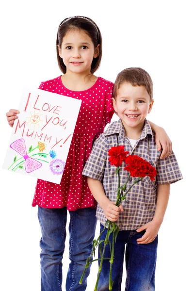 Two kids with greetings for mum — Zdjęcie stockowe