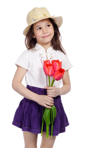 Menina sorridente segurando um buquê de tulipas — Fotografia de Stock