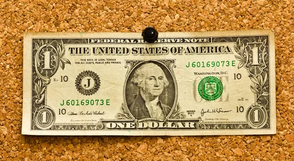 Dollarbiljet aan een kurk boord — Stockfoto