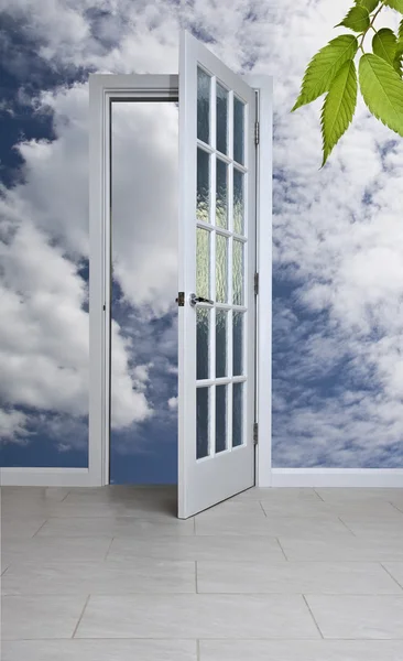 Stock image White door and blue sky