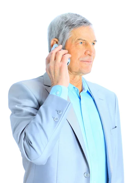 Nice businessman at the age of talking on the phone. Isolated on a white background. — Stock Photo, Image