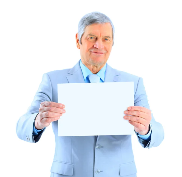 stock image Nice businessman at the age of't holding a big white poster. Isolated on a white background.