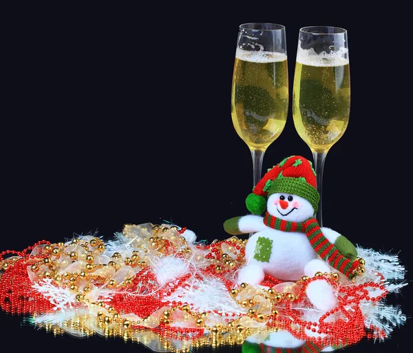 Glasses of champagne with snowmen, decorated, on a black background — Stock Photo, Image