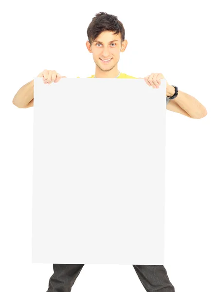 Retrato de um jovem bonito sorridente com banner em branco — Fotografia de Stock