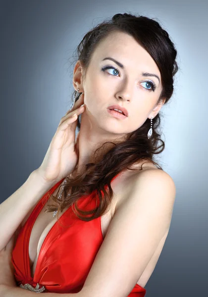 Beautiful girl in the red dress. Isolated on a black background. — Stock Photo, Image
