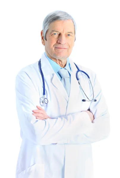 Portrait of confident senior doctor with his hands folded on whi — Stock Photo, Image