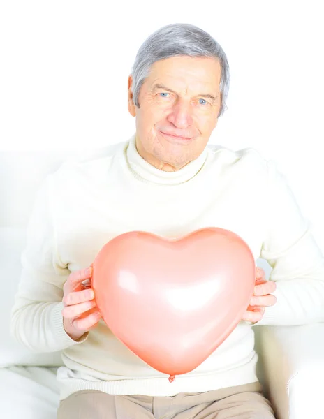 Male senior red heart isolated on white background. — Stock Photo, Image