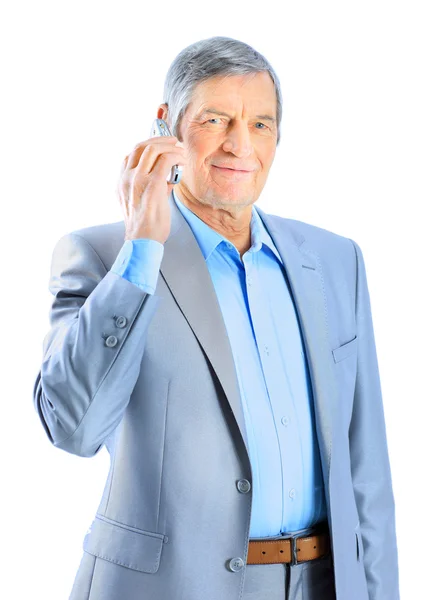 Nice businessman at the age of talking on the phone. Isolated on a white background. — Stock Photo, Image