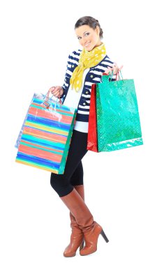 Portrait of a happy young adult girl, with color-coded bags. clipart