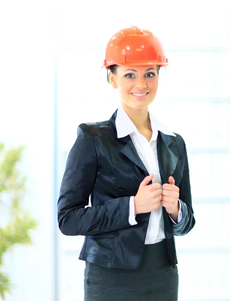 A woman engineer in a suit and a helmet. — Stock Photo, Image