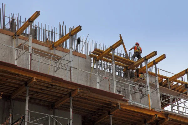 stock image Workers in action during construction of a steel beam office bui