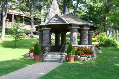 Old stone garden gazebo at boldt castle clipart