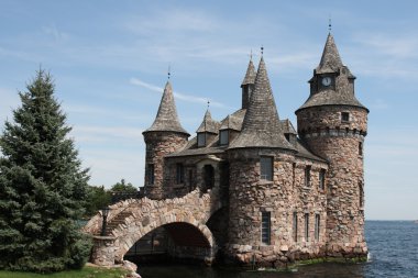 Ancient boldt stone castle with moat and bridge clipart