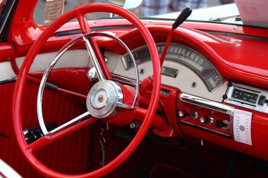 Steering wheel and dashboard interior of vintage classic car clipart