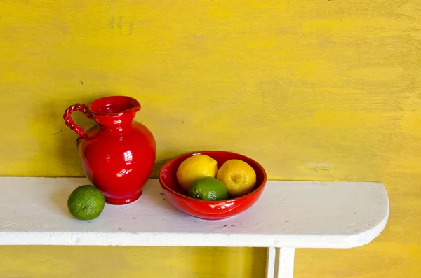 Still life with lemons and jug — Stock Photo, Image