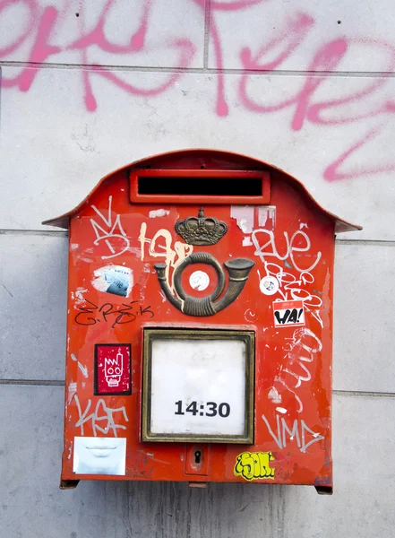 Red postbox in the street — Stock Photo, Image