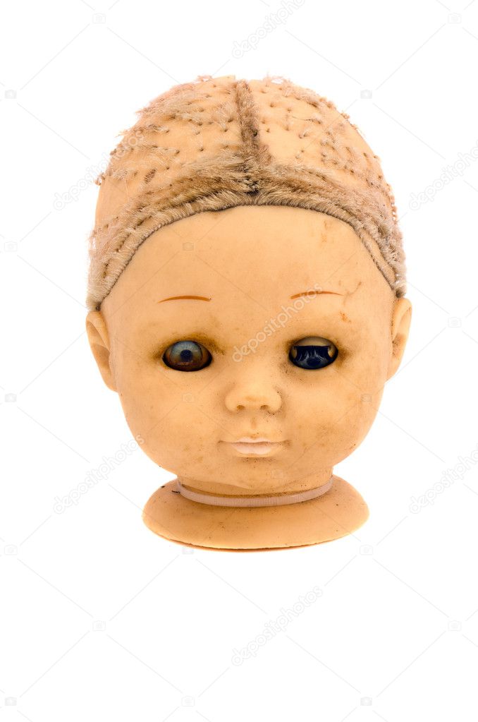 Isolated old and grunge dolls head