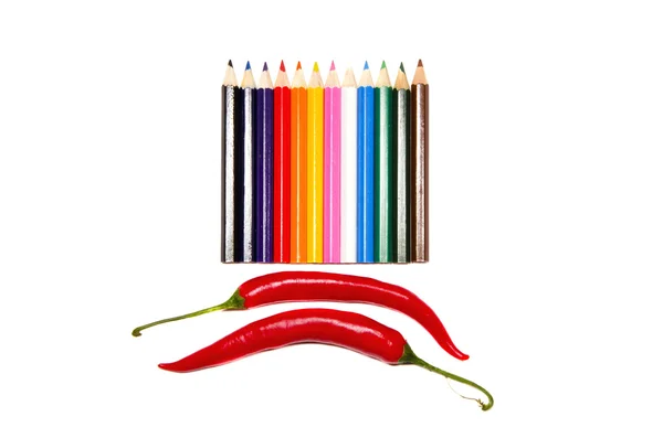 Ізольована барвиста палітра олівців та два перці — стокове фото