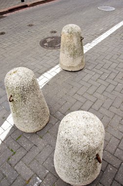 Concrete bollards in the old town clipart