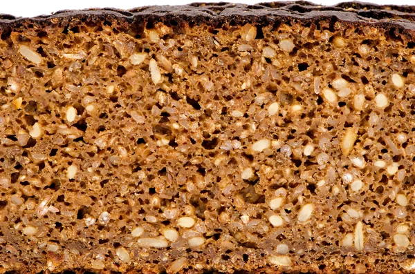 Vários grãos pão preto ecológico — Fotografia de Stock