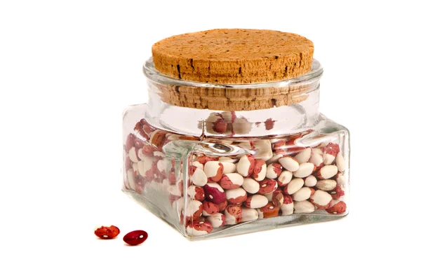 Izolované skleněná nádoba s barevné fazole — Stock fotografie