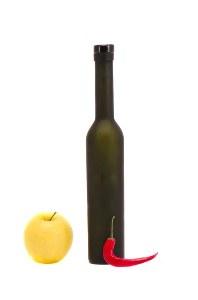 Isolated bottle with apple and pepper — Stock Photo, Image