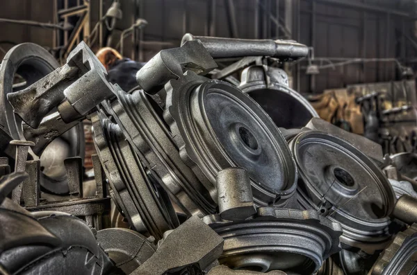 stock image Stack of cast metal parts in a iron foundry