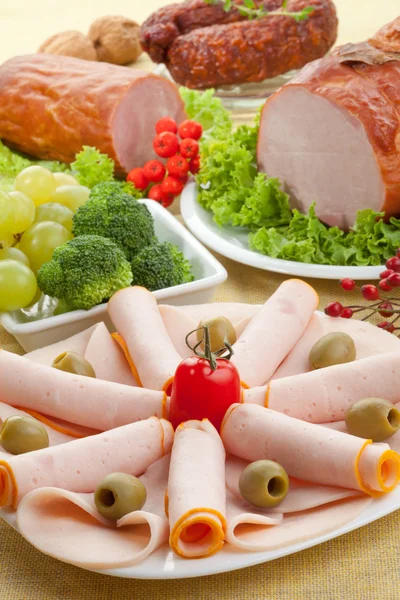 Sausages in whole and slices — Stock Photo, Image