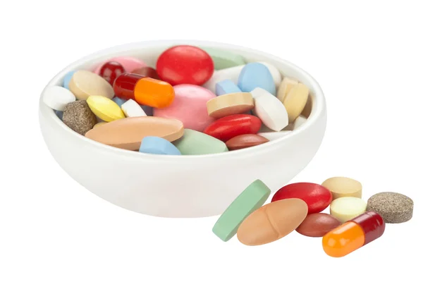 Pílulas coloridas em arco branco — Fotografia de Stock