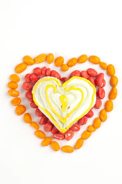 Heart made with gingerbread and dragees of peanuts — Stock Photo, Image