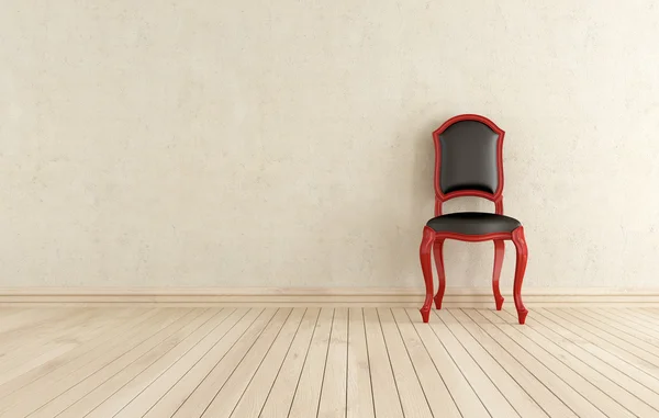 Roter und schwarzer klassischer Stuhl gegen Wand — Stockfoto