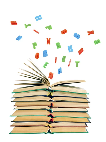 Letras coloridas voando de um livro aberto — Fotografia de Stock